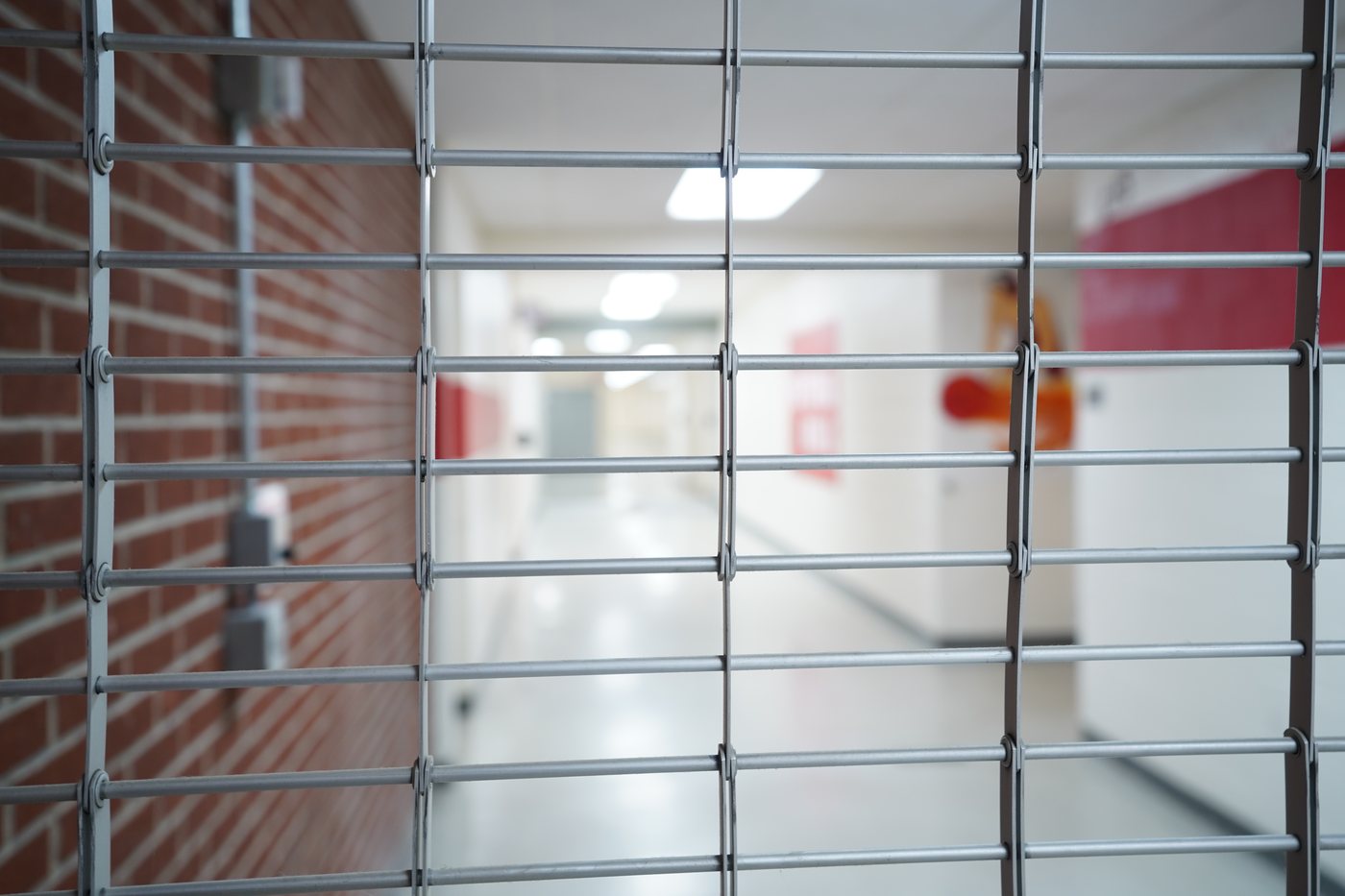 Clopay CrossingGard rolling security grille protecting a storefront opening