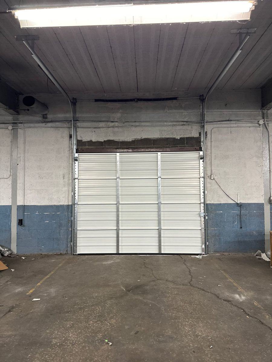 Overhead sectional door installation complete